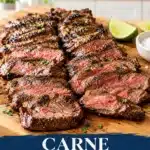Sliced grilled carne asada with a browned crust and pink center on a wooden board
