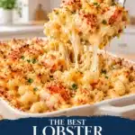 Sliced grilled lobster mac with a browned crust and pink center on a wooden board