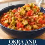Sliced okra and cooked tomatoes in red sauce with a spoonful lifted above the bowl